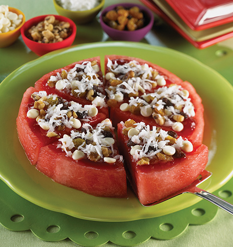 Kids  Watermelon Pizza Supreme Recipe, that is made from watermellon, chocolate chips, strawberry preserves... 