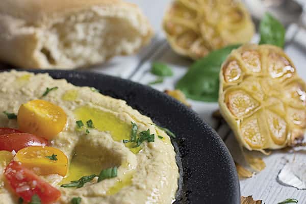 Bruschetta-Topped Hummus Recipe. Easy and delicious bruschetta topped with hummus.