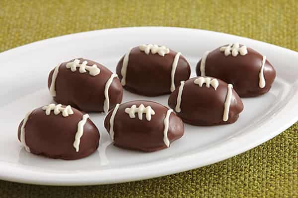 Chocolate Raspberry Football Cookie Truffles Recipe. Wonderful chocolate and raspberry, football shaped cookies. Great to serve for the big game! 