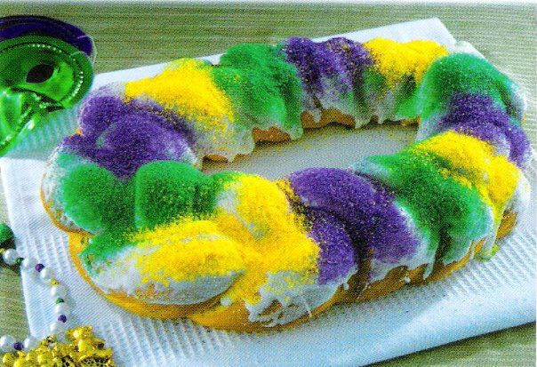 Cajun King Cake recipe. This cake is made for Mardi Gras, and has a special suprise inside. An oven proof baby doll. If You get the baby doll in your piece of cake,you have to make the next King Cake!