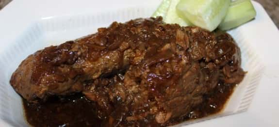 Round steak that is tenderized, seasoned, and simmered in a brown gravy. Wonderful served over rice.